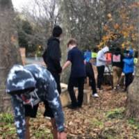 students installing birck and cement blocks Shawmut Hills sycamore circle mural site